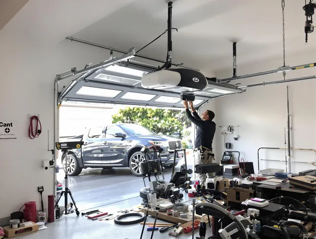Valley Falls Garage Door Repair specialist installing smart garage door opener system in Valley Falls home