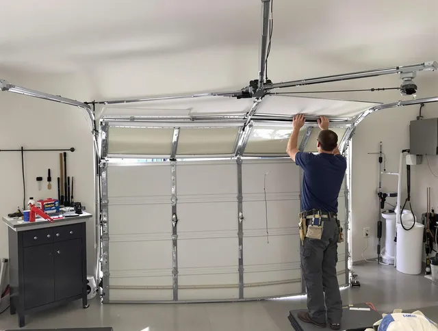 Valley Falls Garage Door Repair specialist performing precise section replacement on Valley Falls garage door